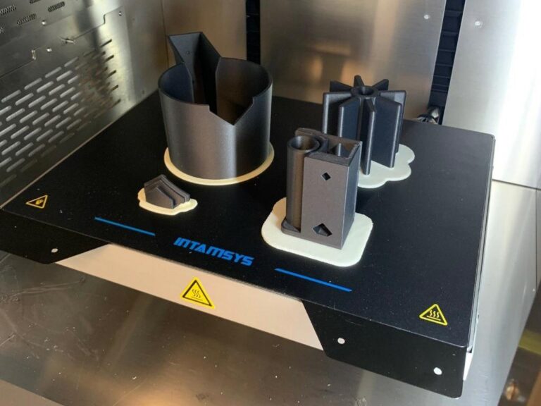 This 3D printed drill jig let us precisely drill and tap angled holes in some of our frame components.